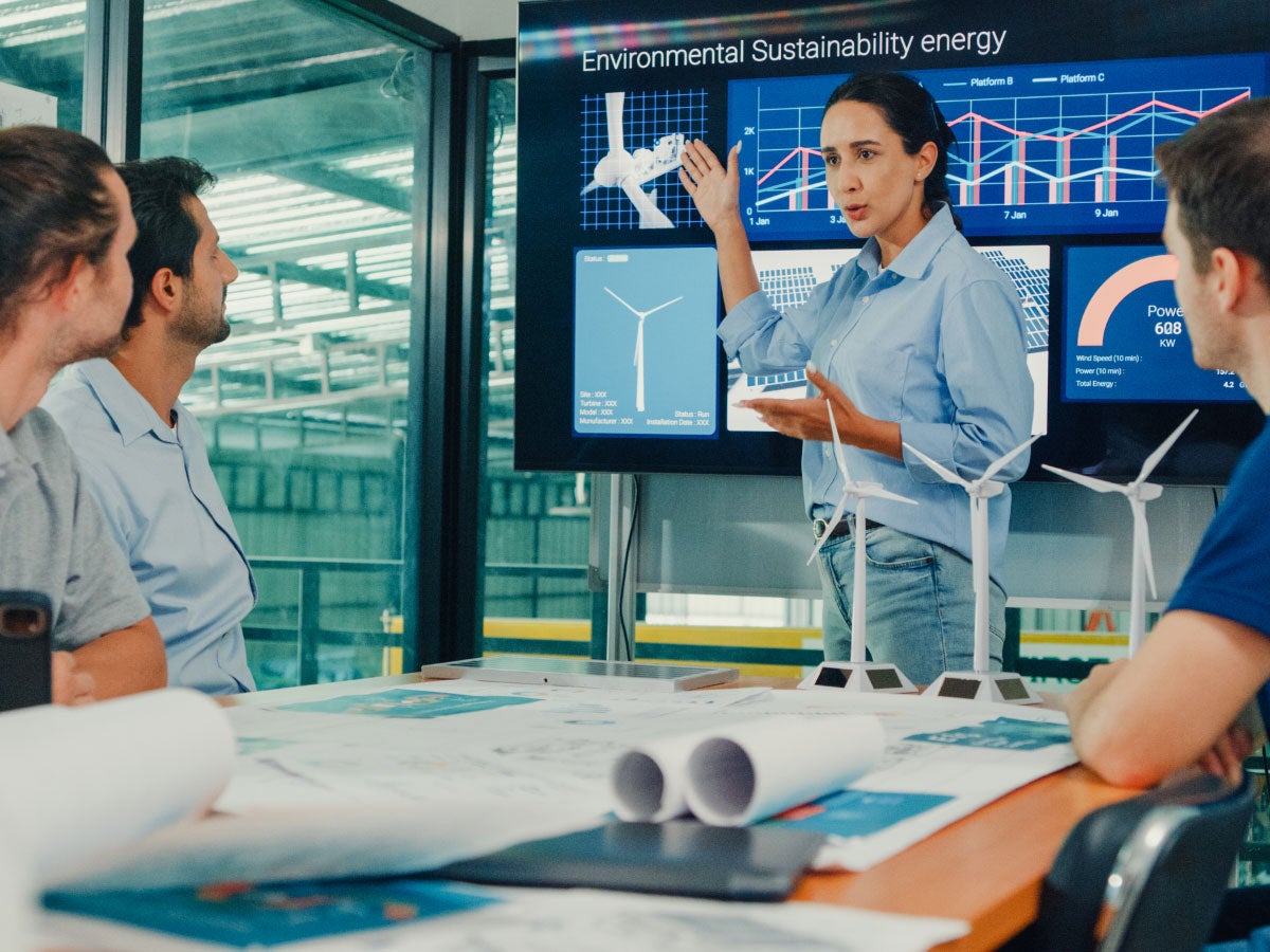 Group of colleagues having a meeting about wind turbines